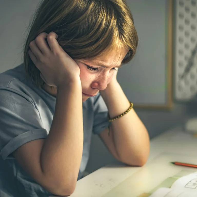 upset-schoolgirl-doing-lessons-her-homework-learning-difficulties